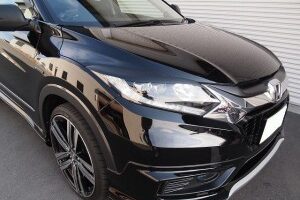 Black SUV/ crossover at a three-quarter front view, showing glossy paint, angular headlights, and large alloy wheels.